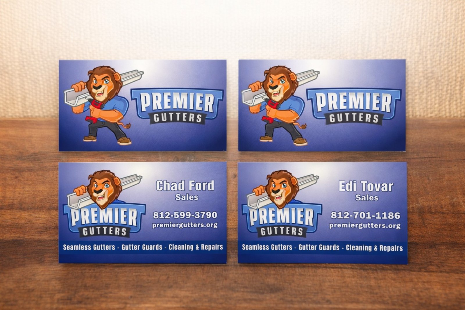 Mad Town Print business card printing examples for Madison Indiana contractors and small businesses on a dark tabletop